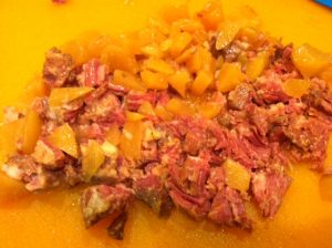 After draining the liquid chop the potato and meat!
