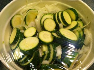 Salted Cucumbers with onions to draw out the moisture to receive the vinegar and spices.