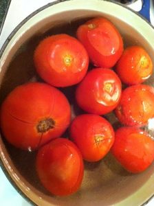 Tomatoes in simmering water