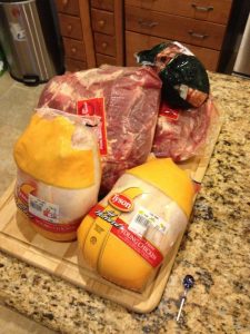 Meat waiting to be trimmed of excess fat skin and then boiled; Chicken, Lamb, and Pork