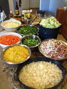 Produce is prepped while meat is cooking